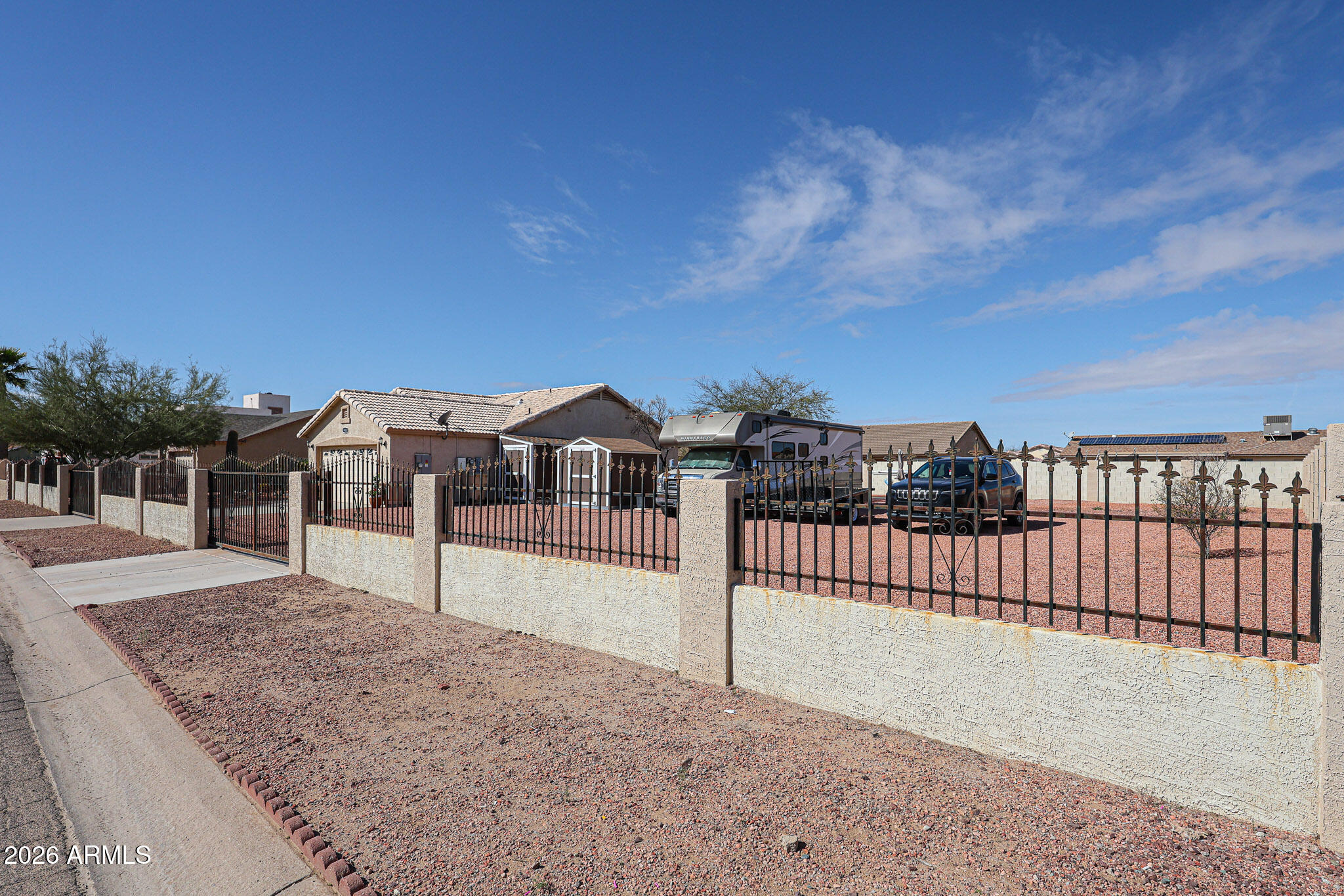 14980 South Capistrano Road Arizona City, AZ 85123 - Photo 30 of 39 a view of a house with a yard