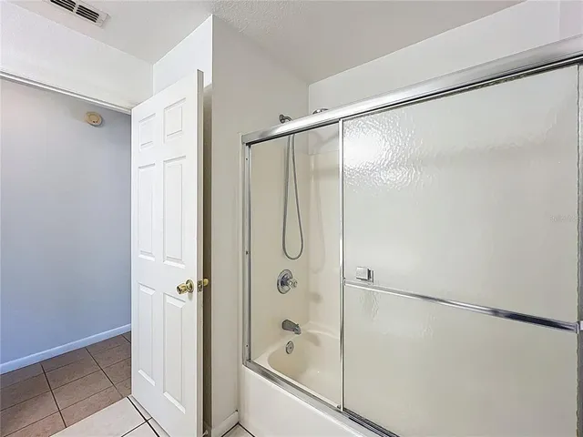 a view of an empty room with windows