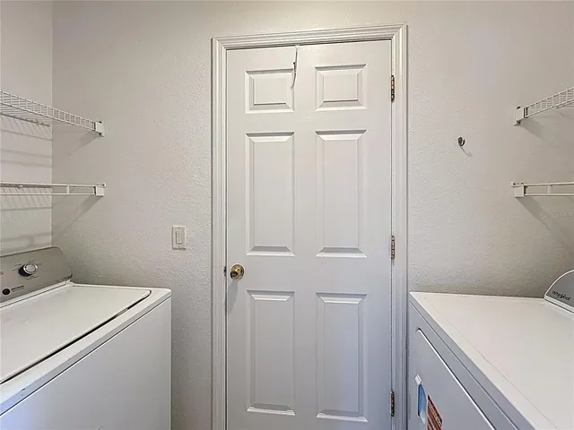 a view of an empty room and a window