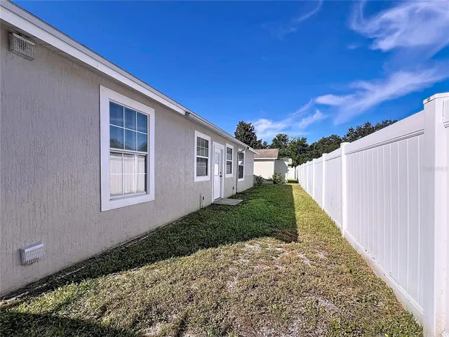 a backyard of a house with lots of green space