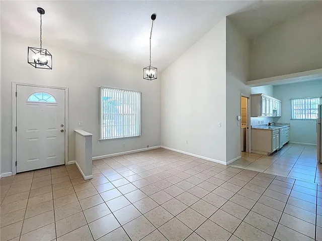 a kitchen with granite countertop a sink stove and cabinets