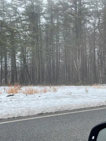 a view of wooden floor with a wooden fence