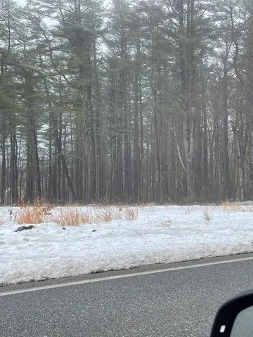 a view of wooden floor with a wooden fence