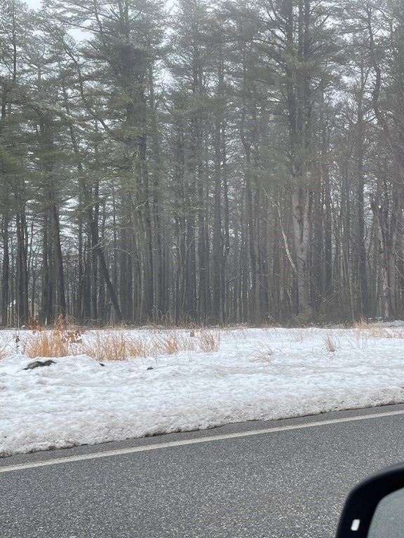 a view of wooden floor with a wooden fence