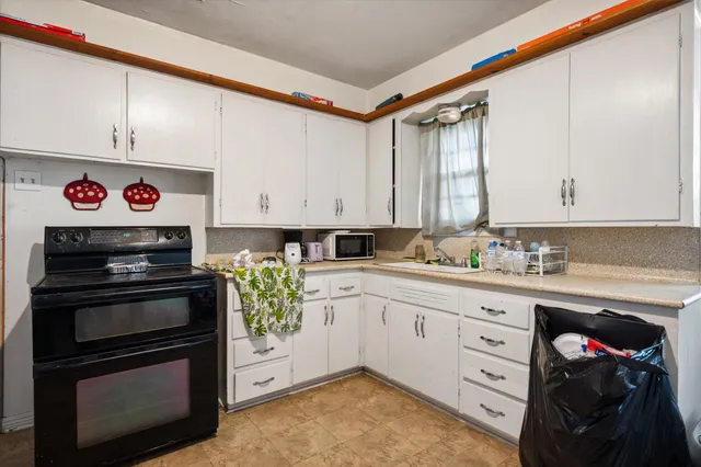a kitchen with a stove and a sink