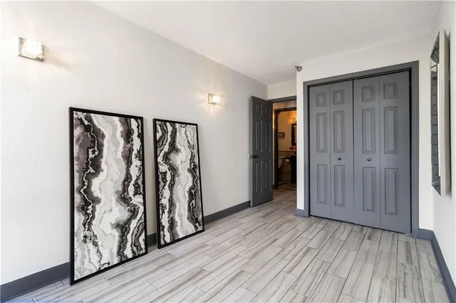 wooden floor with white walls