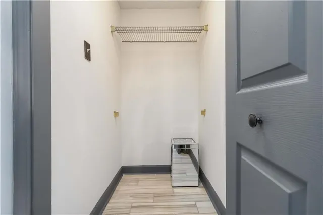 a view of a balcony with furniture and a large window