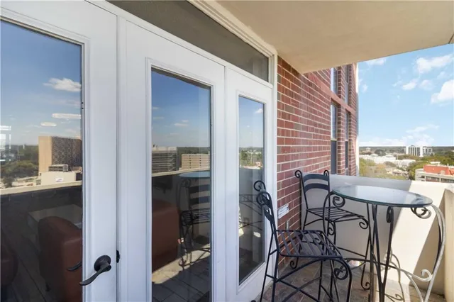 a view of a balcony with city view
