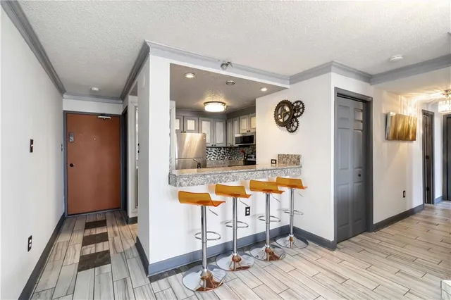 a very nice looking room with a large mirror space and bathroom view