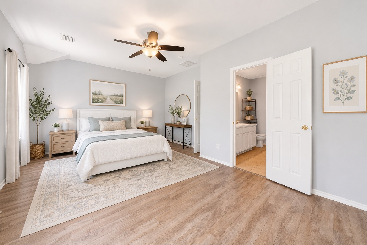 38 Musgrove Place Spring, TX 77382 - Photo 16 of 36 Vaulted primary suite with wide-plank flooring, ceiling fan, and ensuite bath with extended vanity.