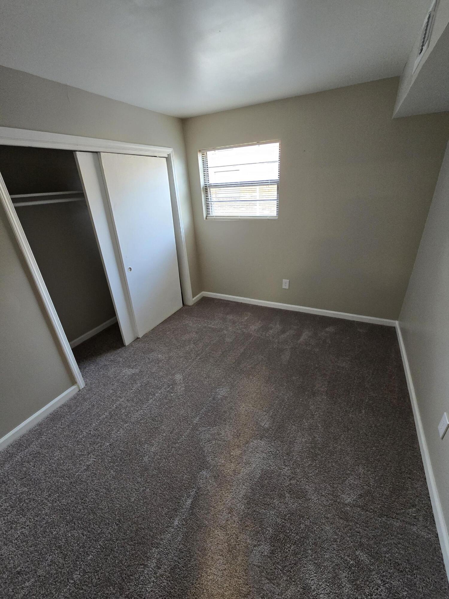 220 8th Street, Unit E10 Vinton, VA 24179 - Photo 9 of 13 a view of an empty room with windows