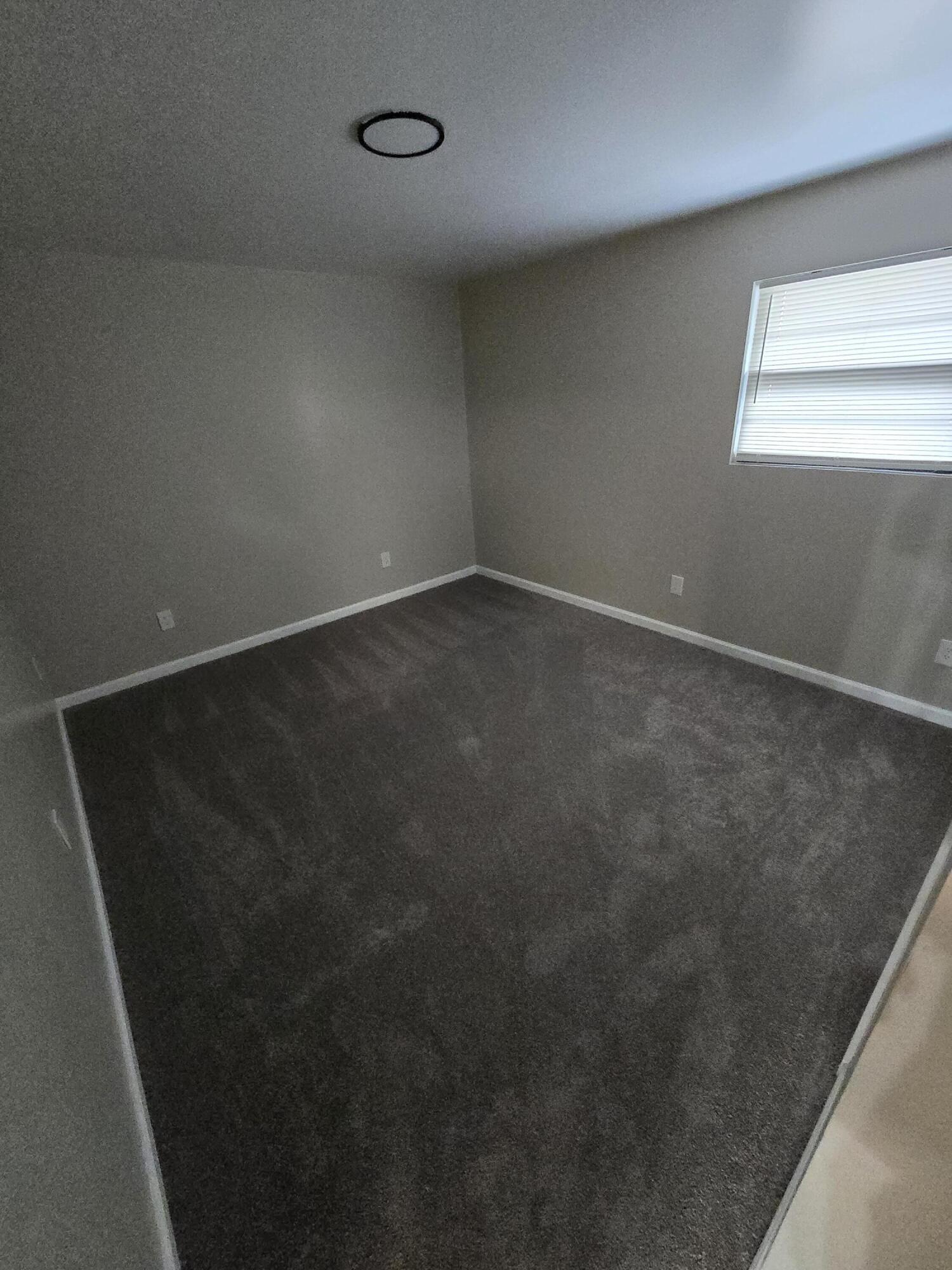 220 8th Street, Unit E10 Vinton, VA 24179 - Photo 10 of 13 an empty room with windows