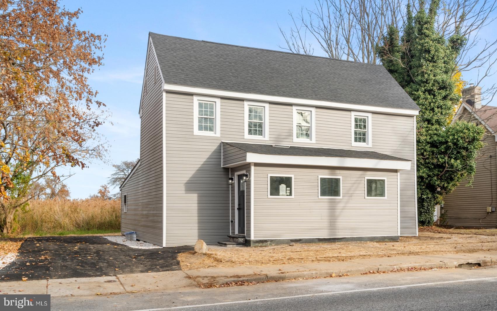 380 Main Street Dover, DE 19901 - Photo 13 of 15 a house that has a tree in front of it