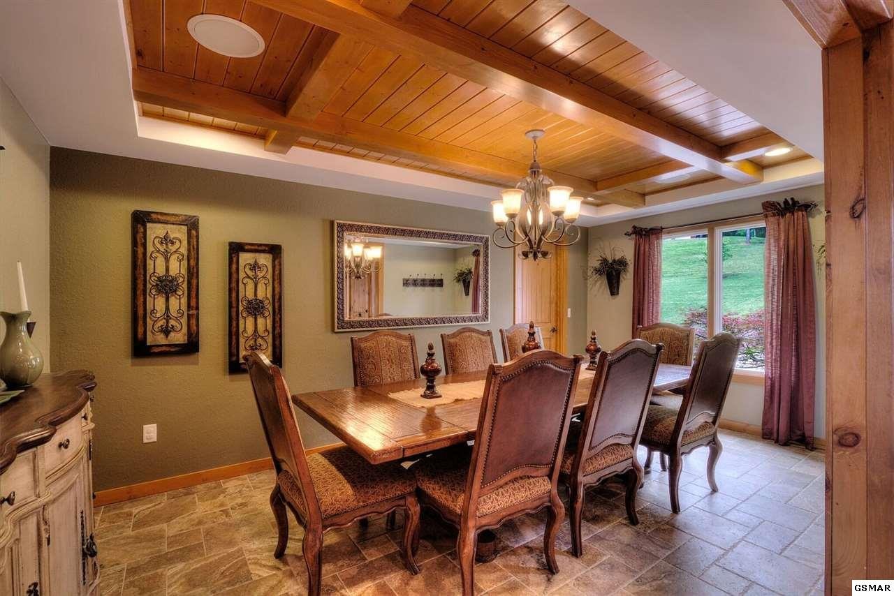 796 Deer Ridge Drive Rutledge, TN 37861 - Photo 13 of 35 a view of a dining room with furniture and chandelier