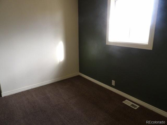 935 Walnut Street Brighton, CO 80601 - Photo 6 of 12 an empty room with a window