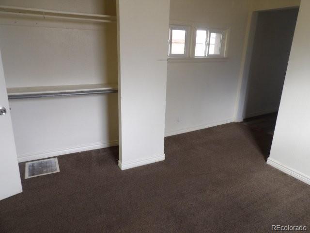 935 Walnut Street Brighton, CO 80601 - Photo 7 of 12 an empty room with windows