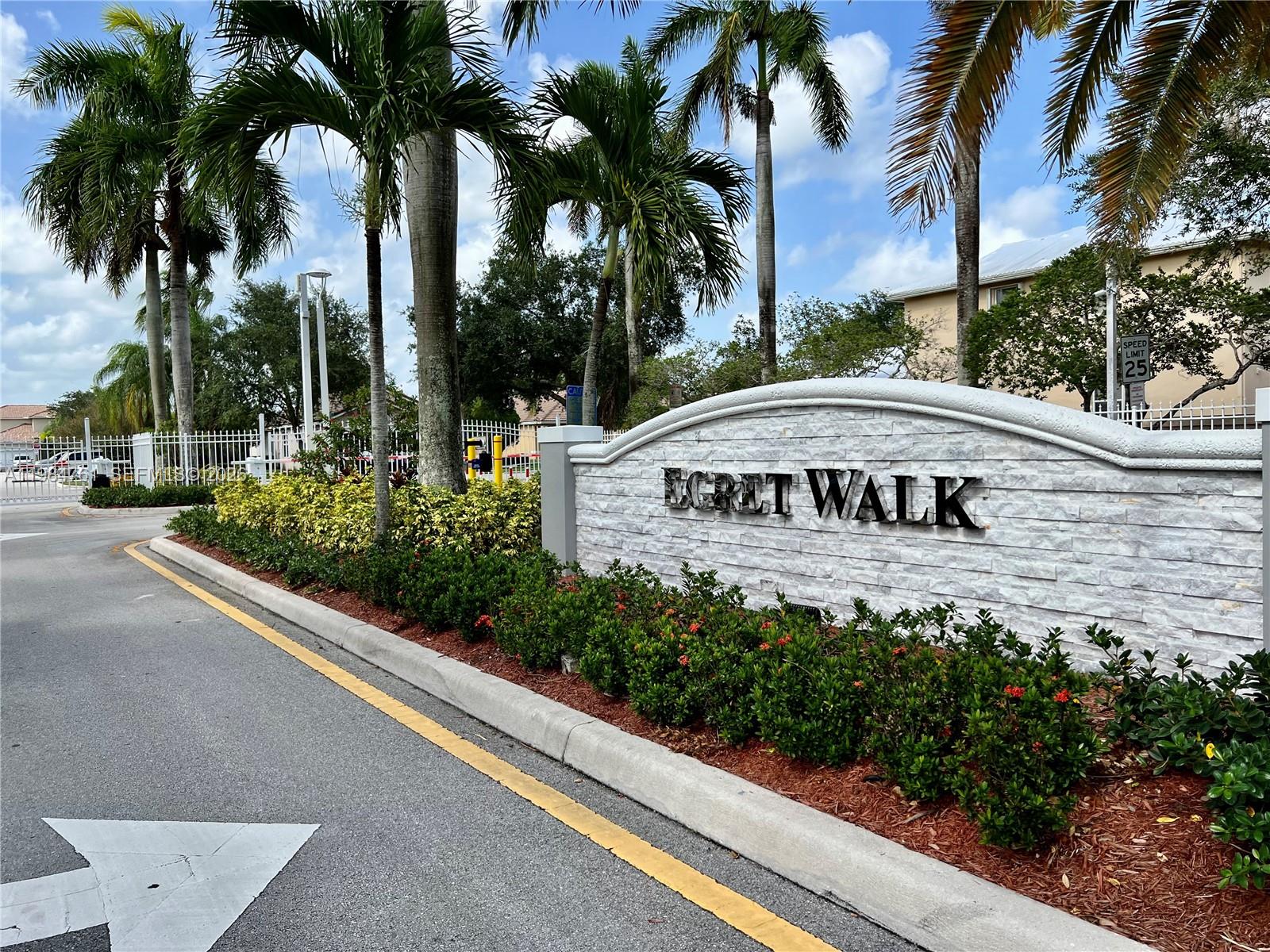 11854 Southwest 8th Street Pembroke Pines, FL 33025 - Photo 1 of 11 a view of a street sign of a building with a street