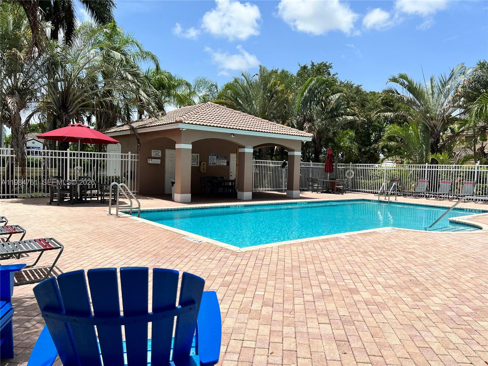 11854 Southwest 8th Street Pembroke Pines, FL 33025 - Photo 11 of 11 a view of house with yard outdoor seating and entertaining space