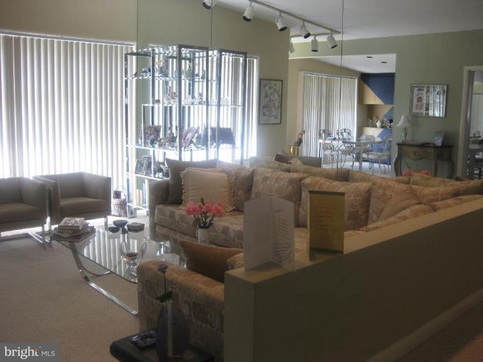 2418 Forest Green Road Baltimore, MD 21209 - Photo 4 of 12 a living room with furniture and a large window