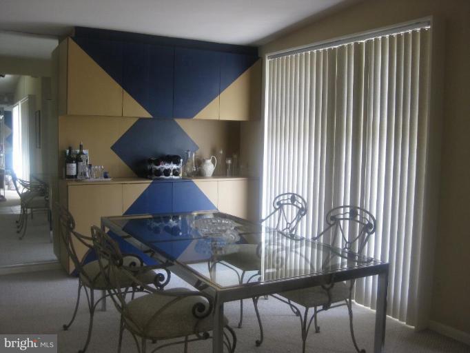2418 Forest Green Road Baltimore, MD 21209 - Photo 5 of 12 a view of a dining room with furniture and wooden floor