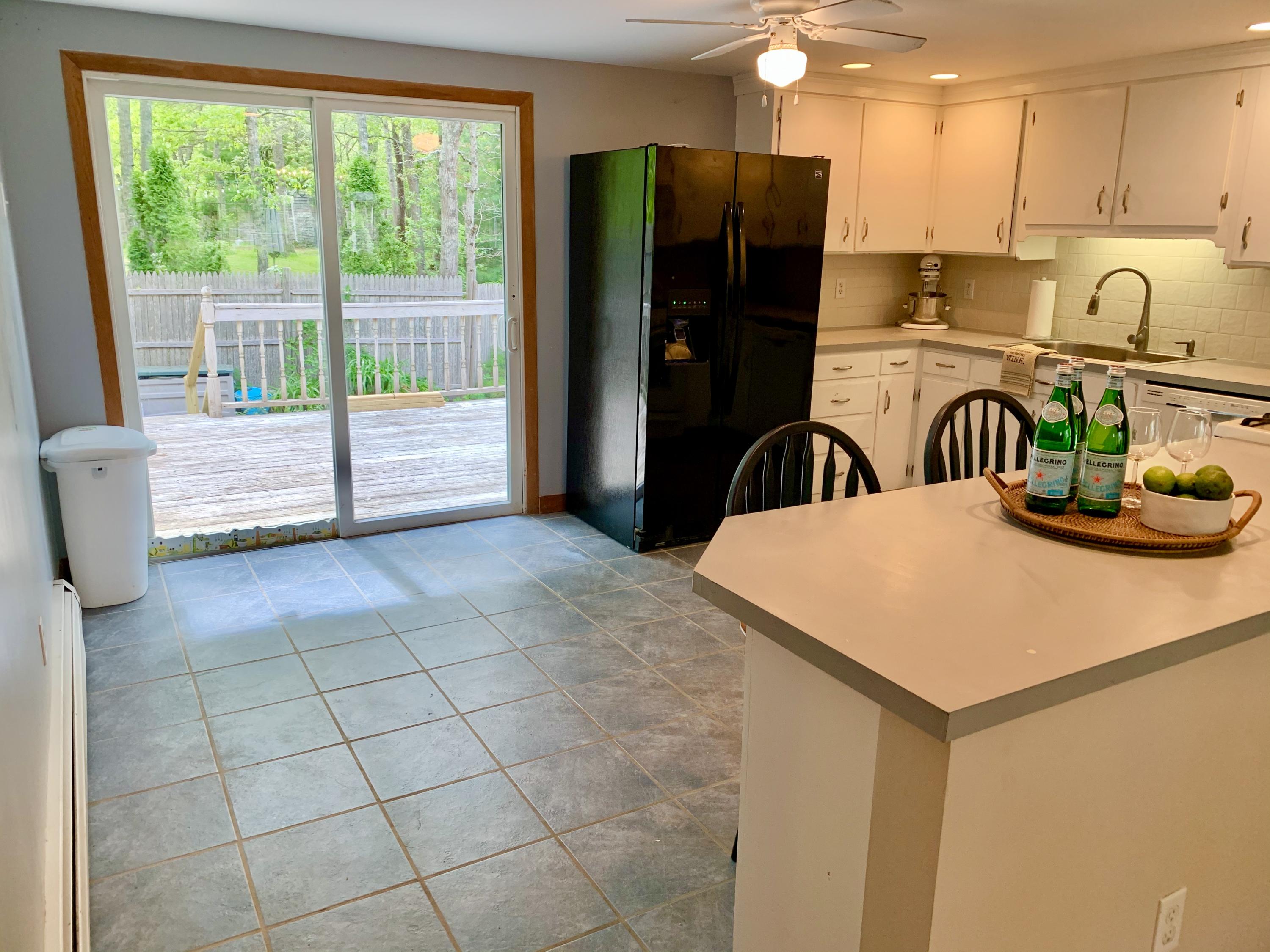 41 Suomi Road Hyannis, MA 02601 - Photo 5 of 25 a kitchen with stainless steel appliances granite countertop a refrigerator a stove a sink and a granite counter tops