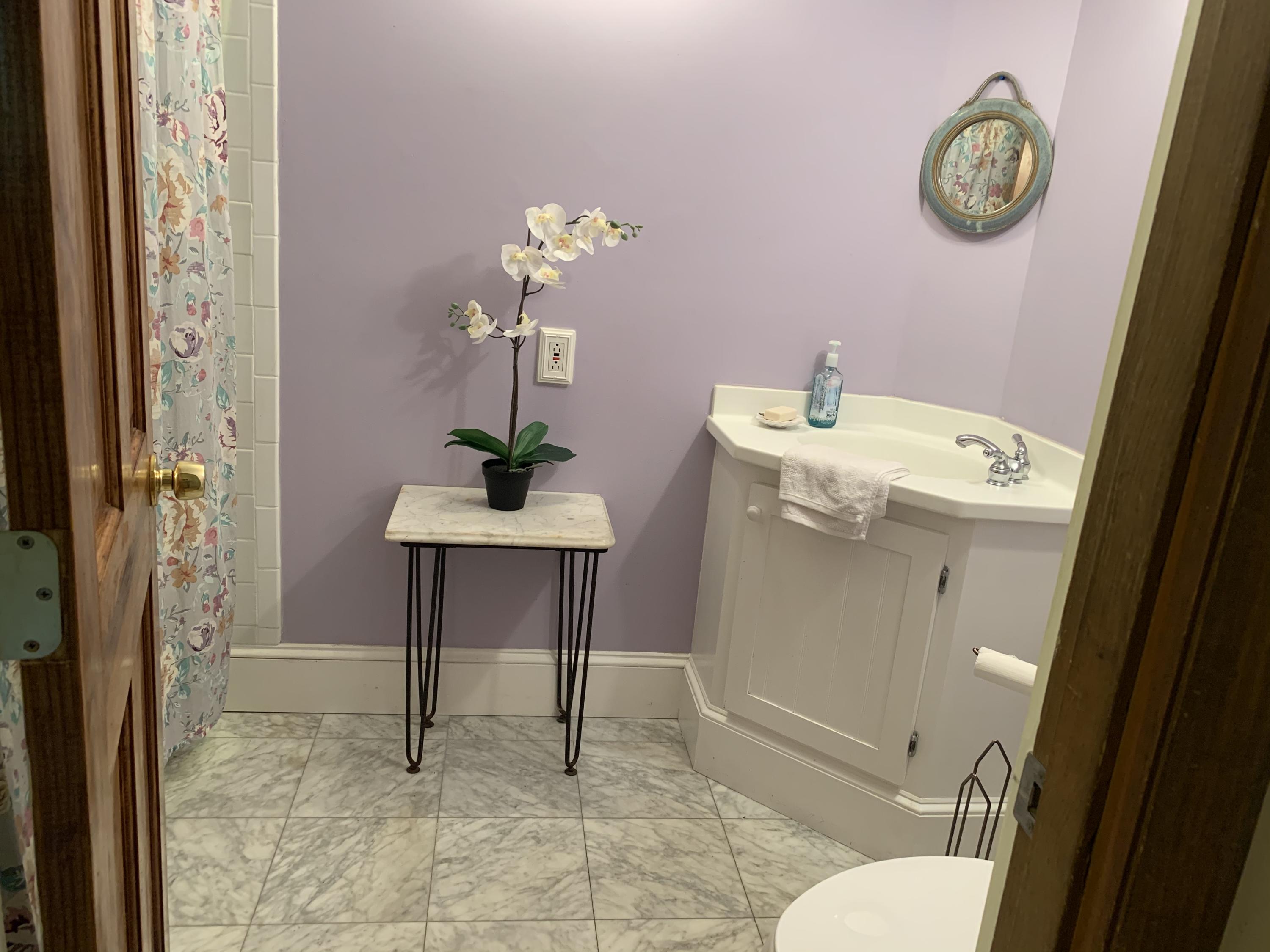 41 Suomi Road Hyannis, MA 02601 - Photo 10 of 25 a bathroom with a sink a toilet and a mirror