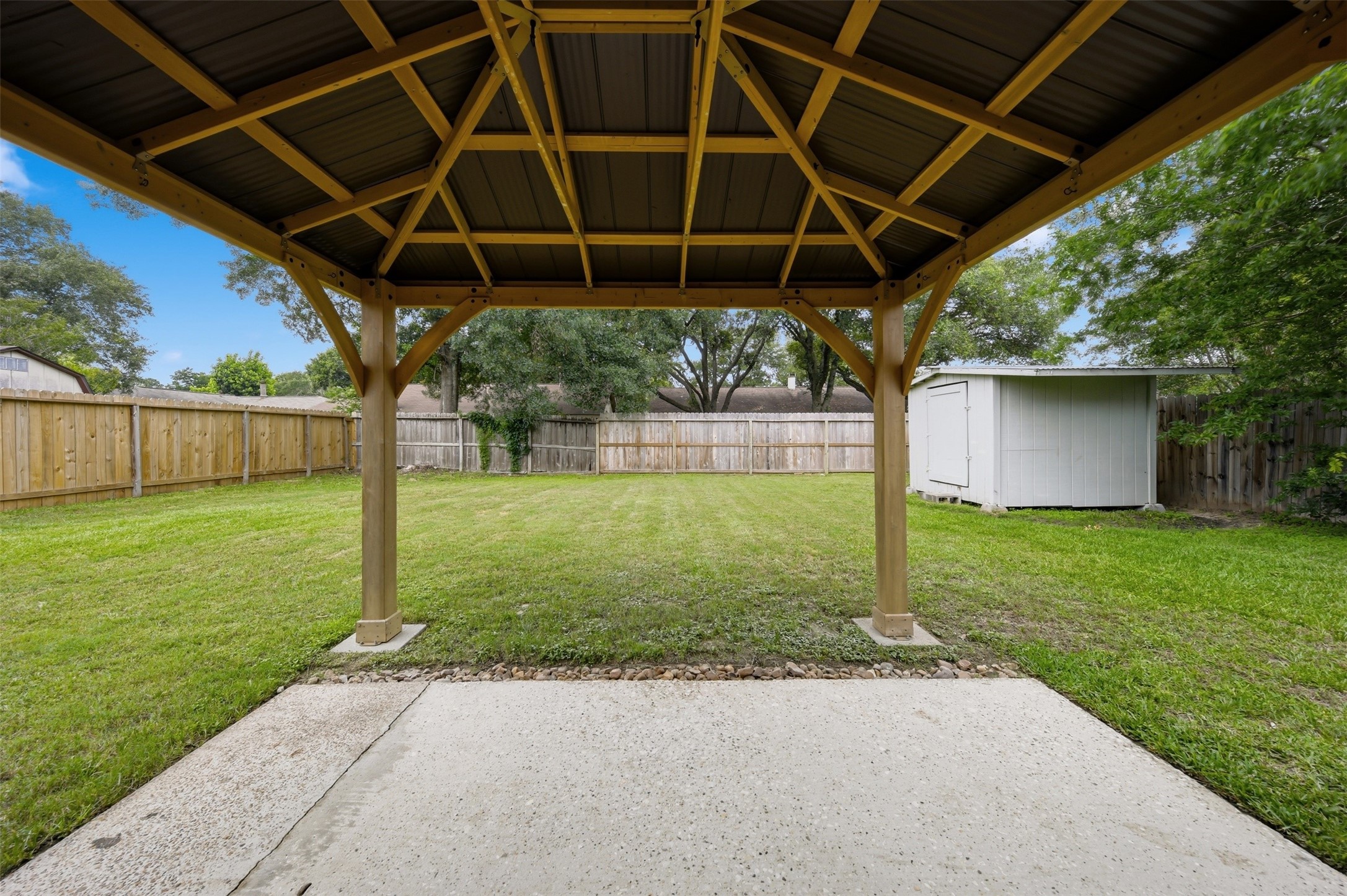 9418 Kilrenny Drive Spring, TX 77379 - Photo 34 of 47 a view of a backyard with table and chairs