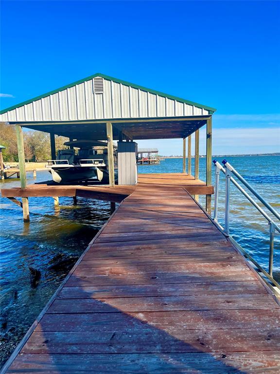 0 LCR 799 Groesbeck, TX 76642 - Photo 2 of 24 a front view of a house with swimming pool and wooden floor