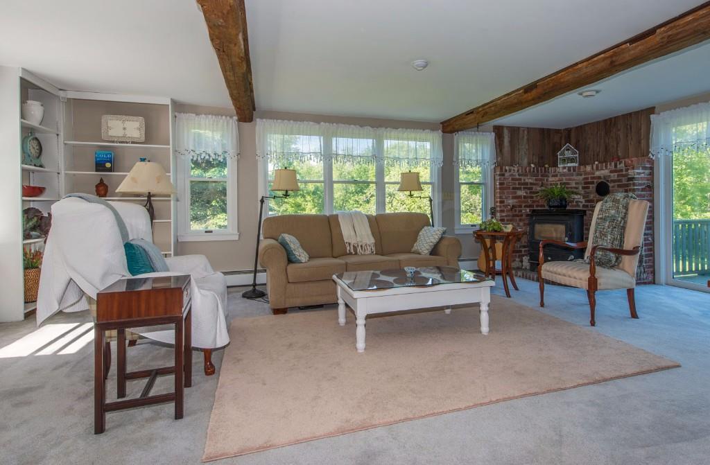 581 Ocean Point Road Boothbay, ME 04544 - Photo 14 of 25 Living room with brick hearth and...