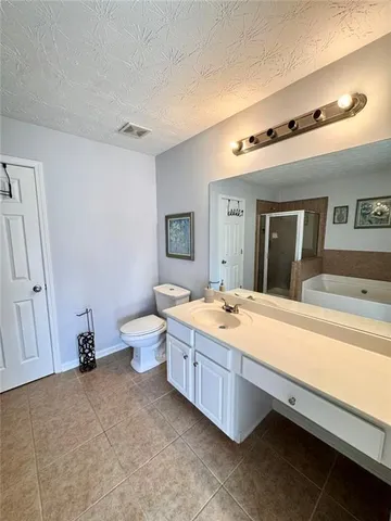 a bathroom with a tub and a shower