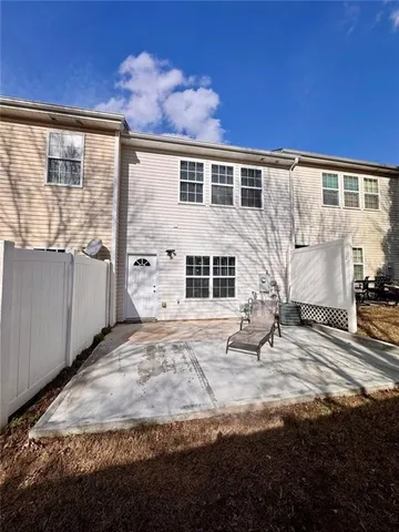 a view of a swimming pool with outdoor seating