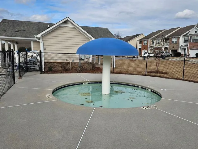 a view of a city street with cars parked