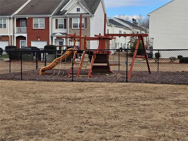 a room with gym equipment and a flat screen tv