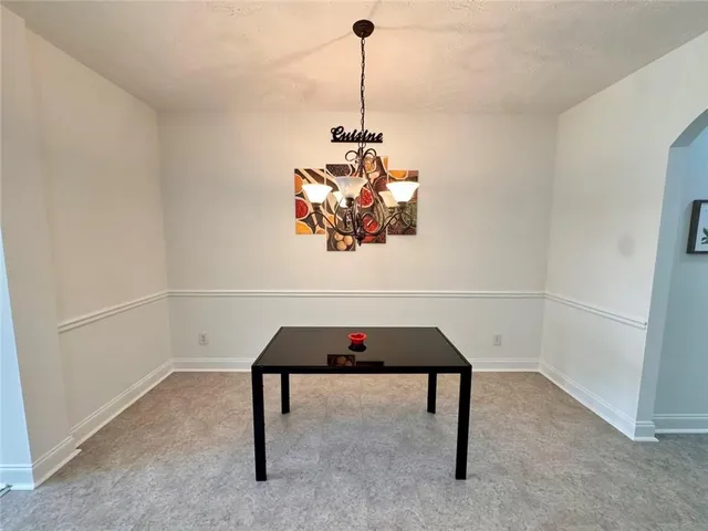 a kitchen with stainless steel appliances granite countertop a stove sink and cabinets