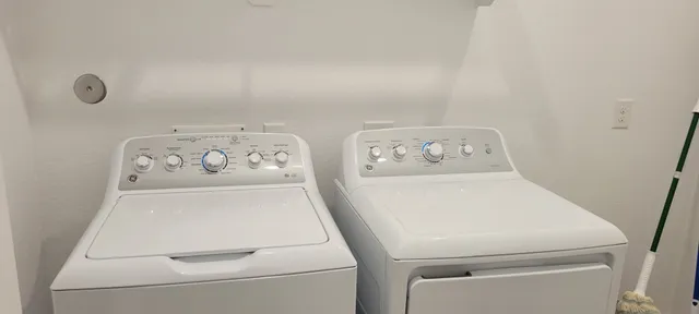 a utility room with dryer and washer