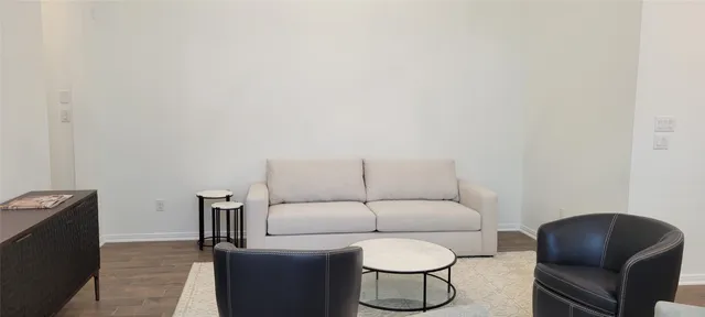 a living room with furniture a rug and a couch