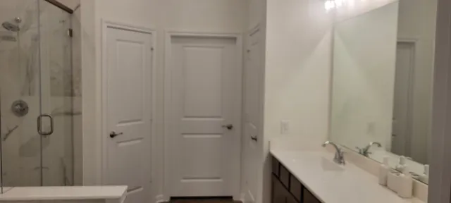 a bathroom with a sink and a mirror