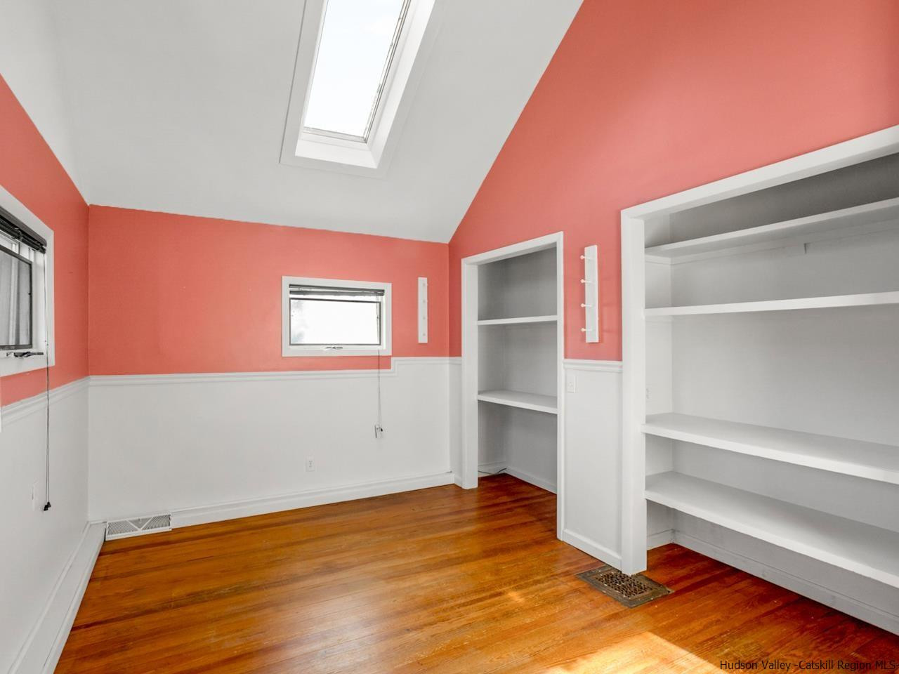 111 Spring Street Catskill, NY 12414 - Photo 16 of 28 a view of empty room with wooden floor and fan