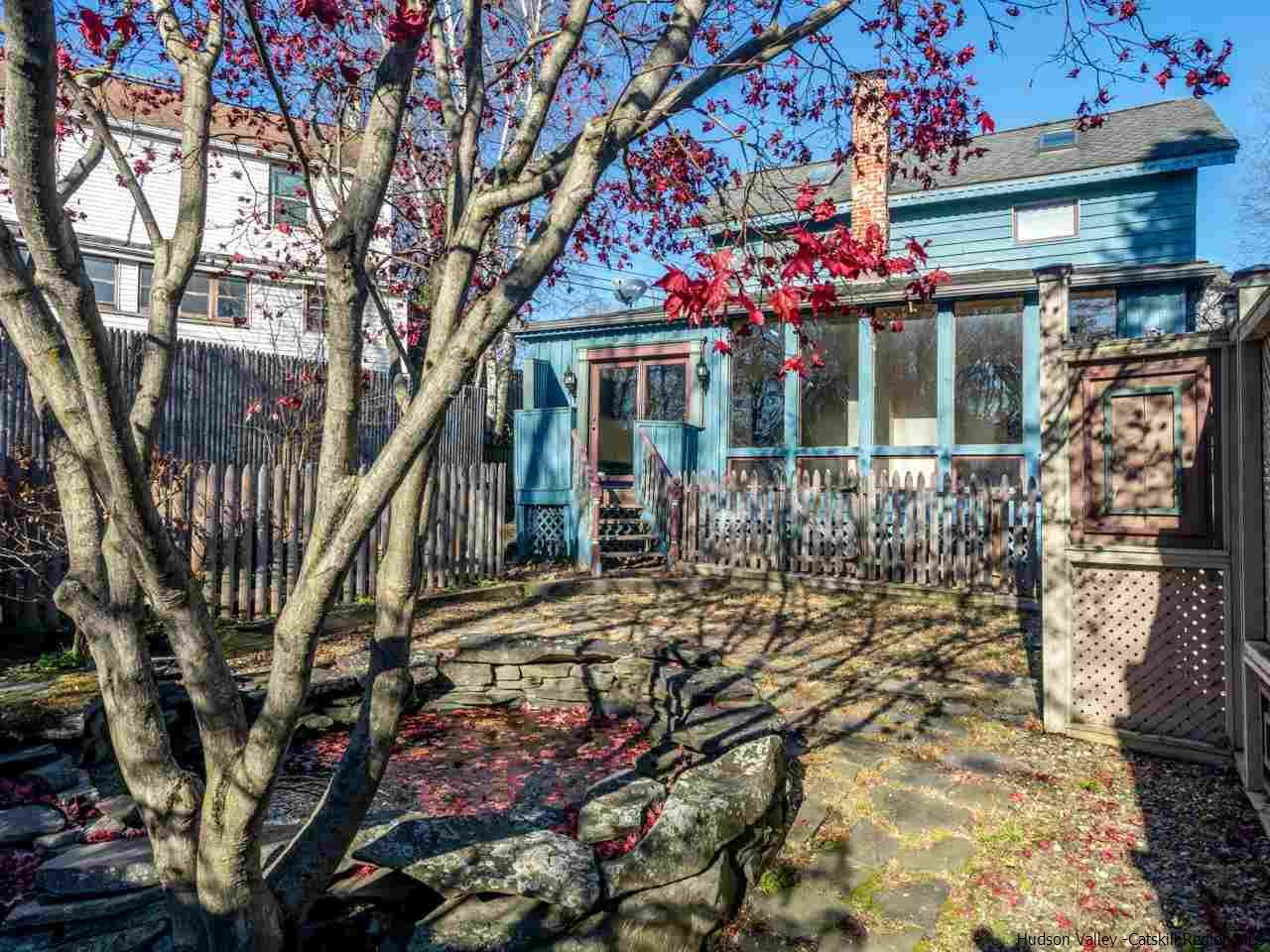 111 Spring Street Catskill, NY 12414 - Photo 2 of 28 a front view of a house with a tree