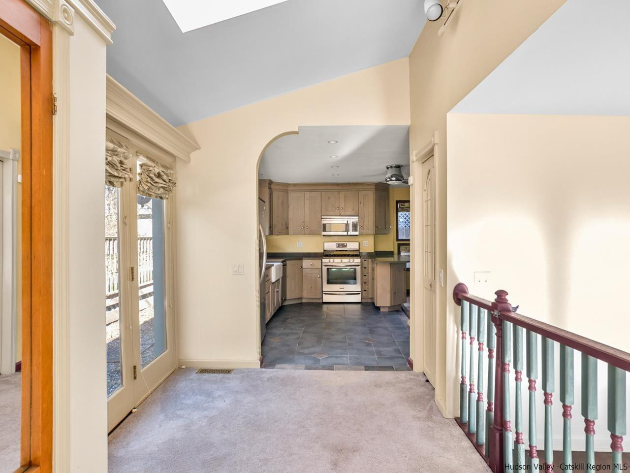 111 Spring Street Catskill, NY 12414 - Photo 21 of 28 a view of a kitchen with a sink and a refrigerator