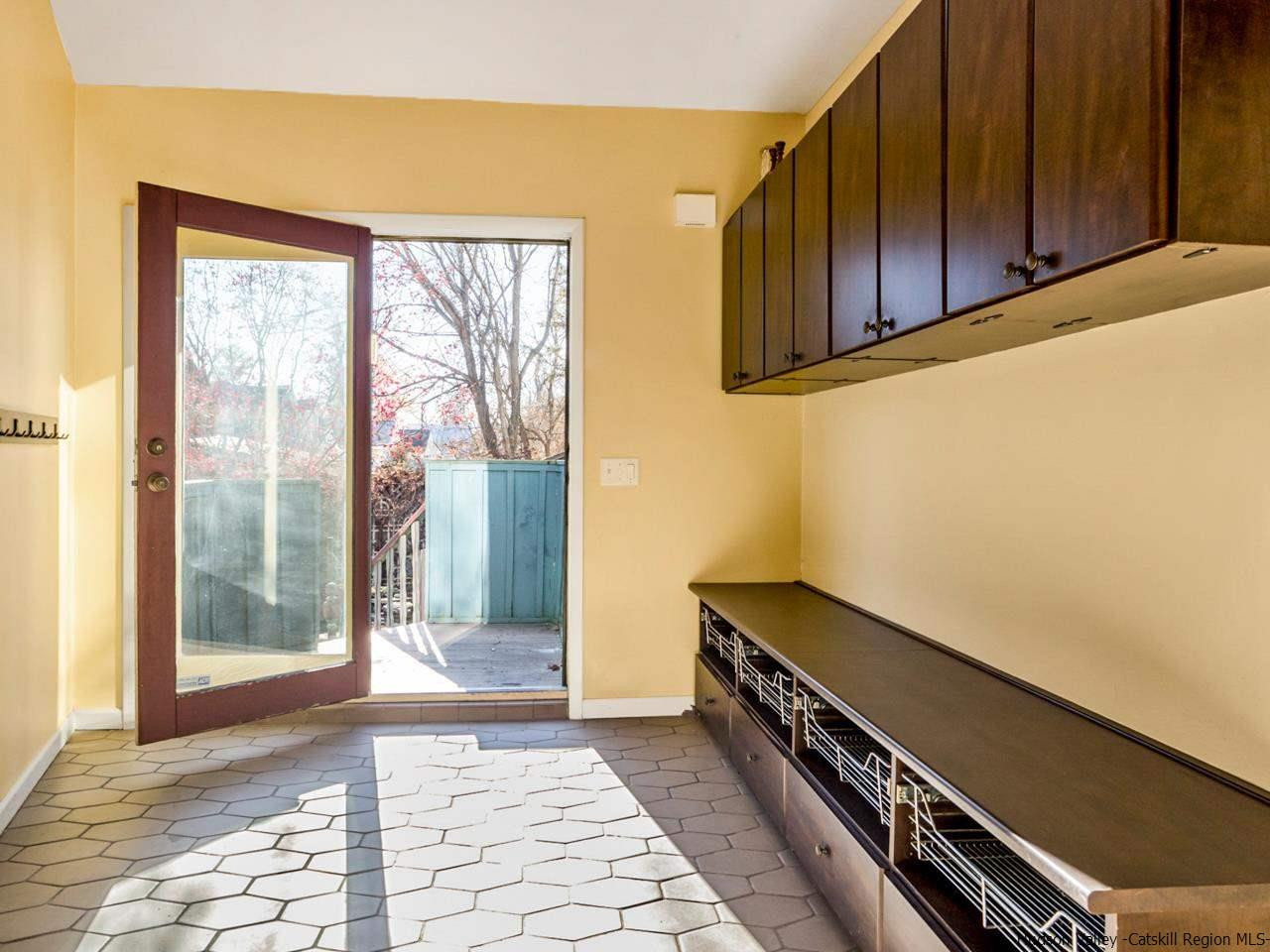 111 Spring Street Catskill, NY 12414 - Photo 5 of 28 a view of a room with wooden floor and windows