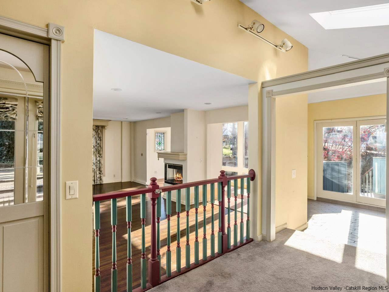 111 Spring Street Catskill, NY 12414 - Photo 6 of 28 a view of a porch with wooden floor and windows
