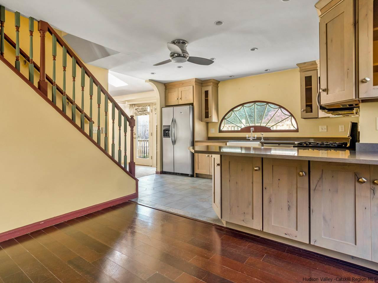 111 Spring Street Catskill, NY 12414 - Photo 9 of 28 a view of a hallway with entryway wooden floor and front door