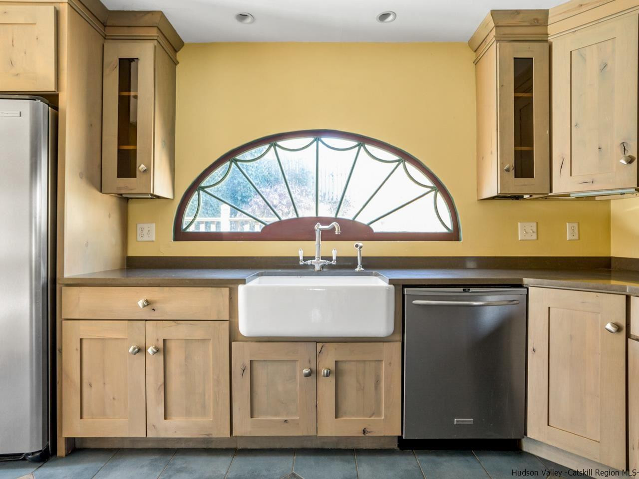 111 Spring Street Catskill, NY 12414 - Photo 10 of 28 a stove top oven sitting inside of a kitchen