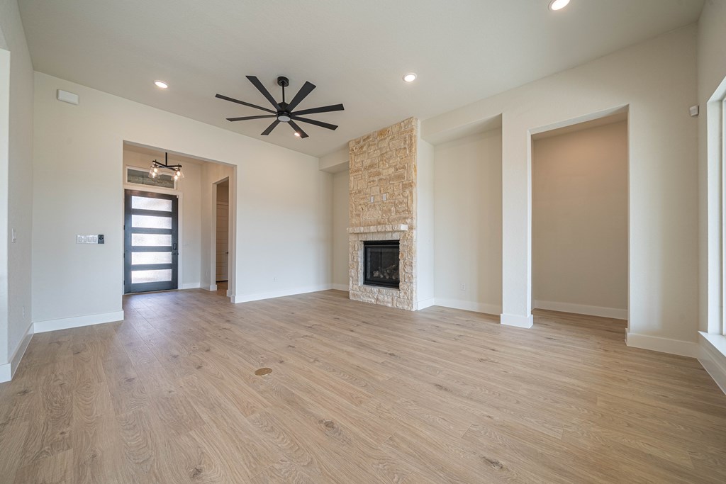 2013 Toscano Way Kerrville, TX 78028 - Photo 6 of 17 a view of a livingroom with a ceiling fan window and wooden floor