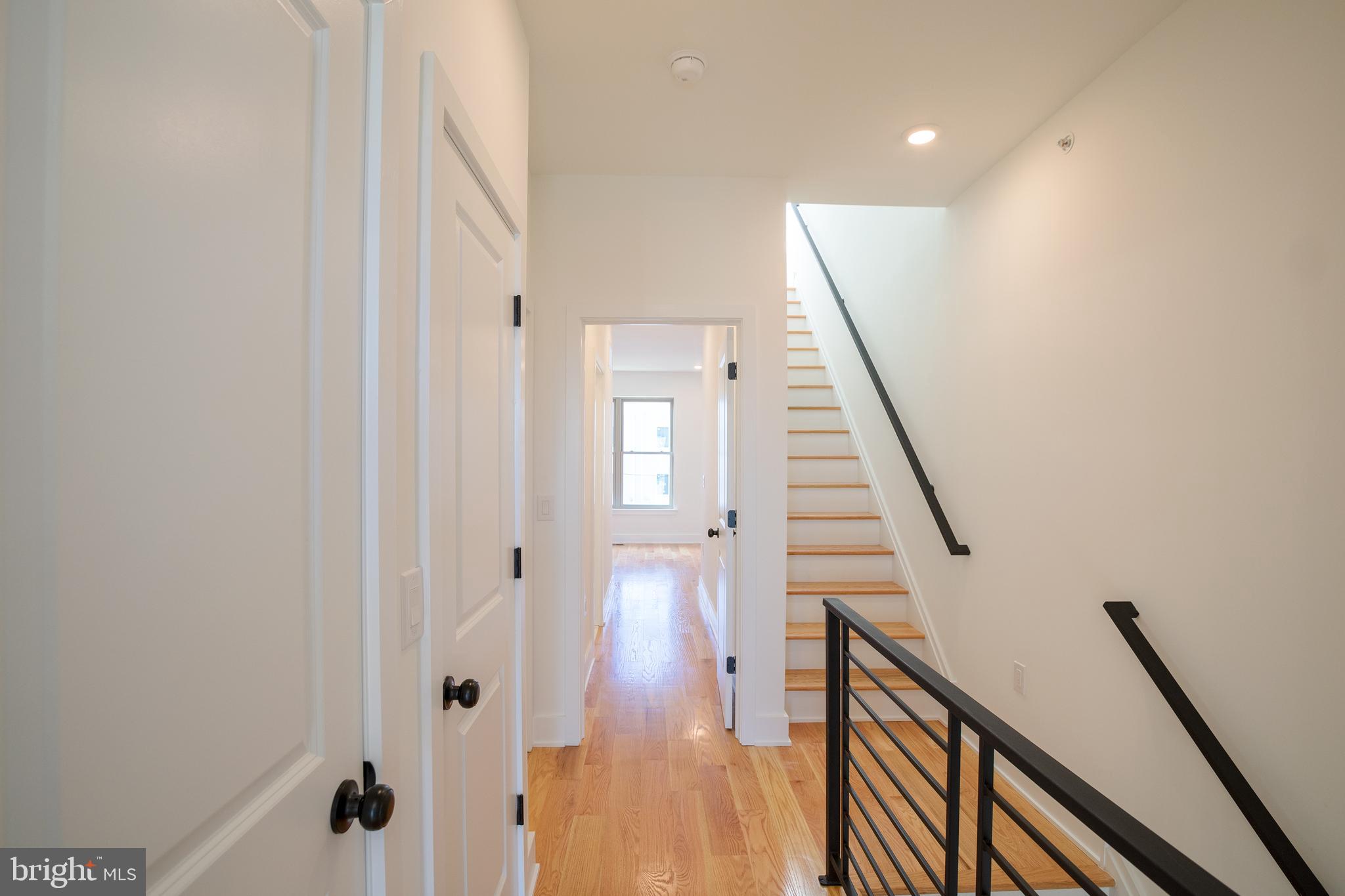 2022 North 5th Street, Unit 2 Philadelphia, PA 19122 - Photo 11 of 23 a view of a hallway with wooden floor and staircase