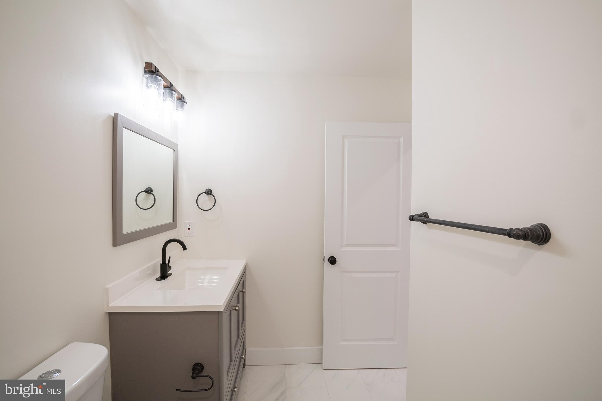 2022 North 5th Street, Unit 2 Philadelphia, PA 19122 - Photo 13 of 23 a bathroom with a sink a toilet and shower