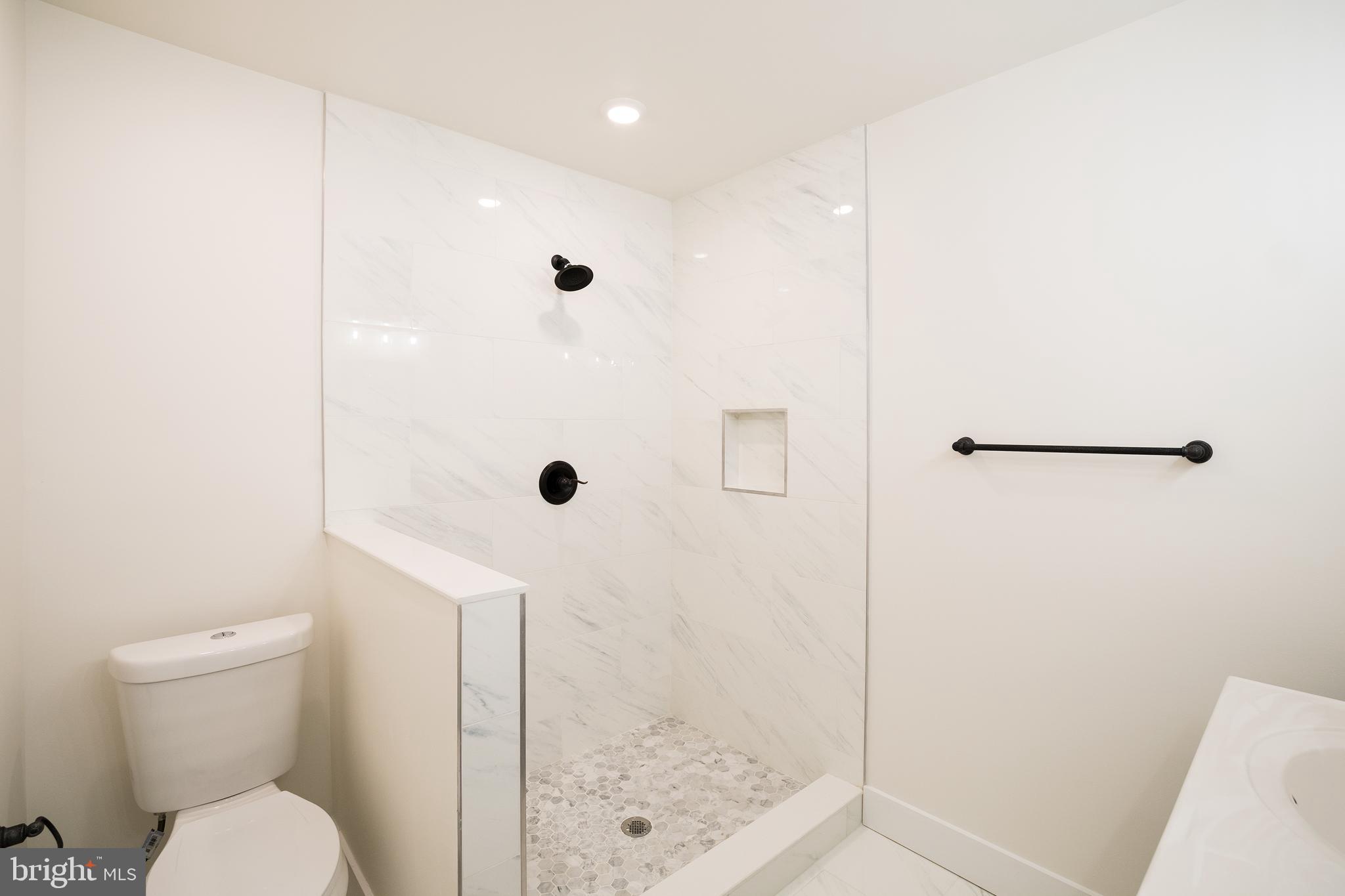 2022 North 5th Street, Unit 2 Philadelphia, PA 19122 - Photo 18 of 23 a bathroom with a shower and toilet