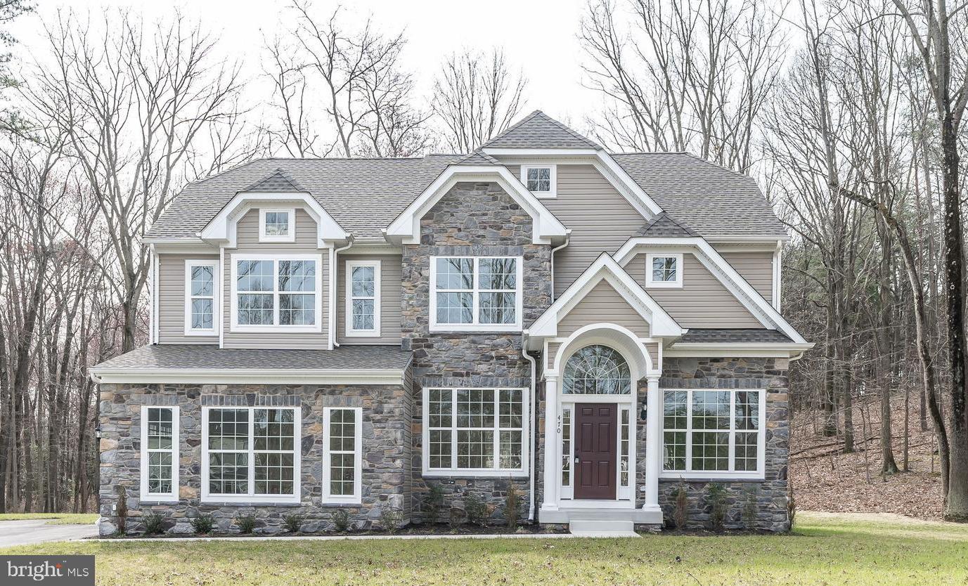 470 Queenstown Road Severn, MD 21144 - Photo 1 of 56 a front view of a house with garden