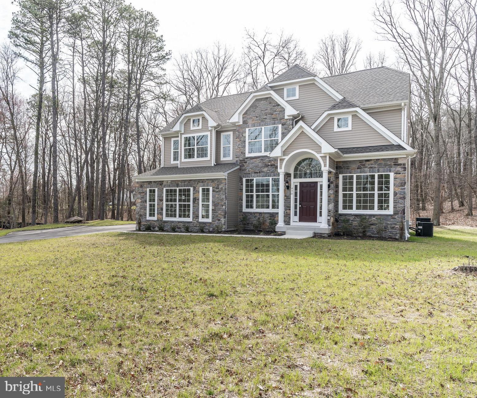 470 Queenstown Road Severn, MD 21144 - Photo 2 of 56 a front view of a house with a garden